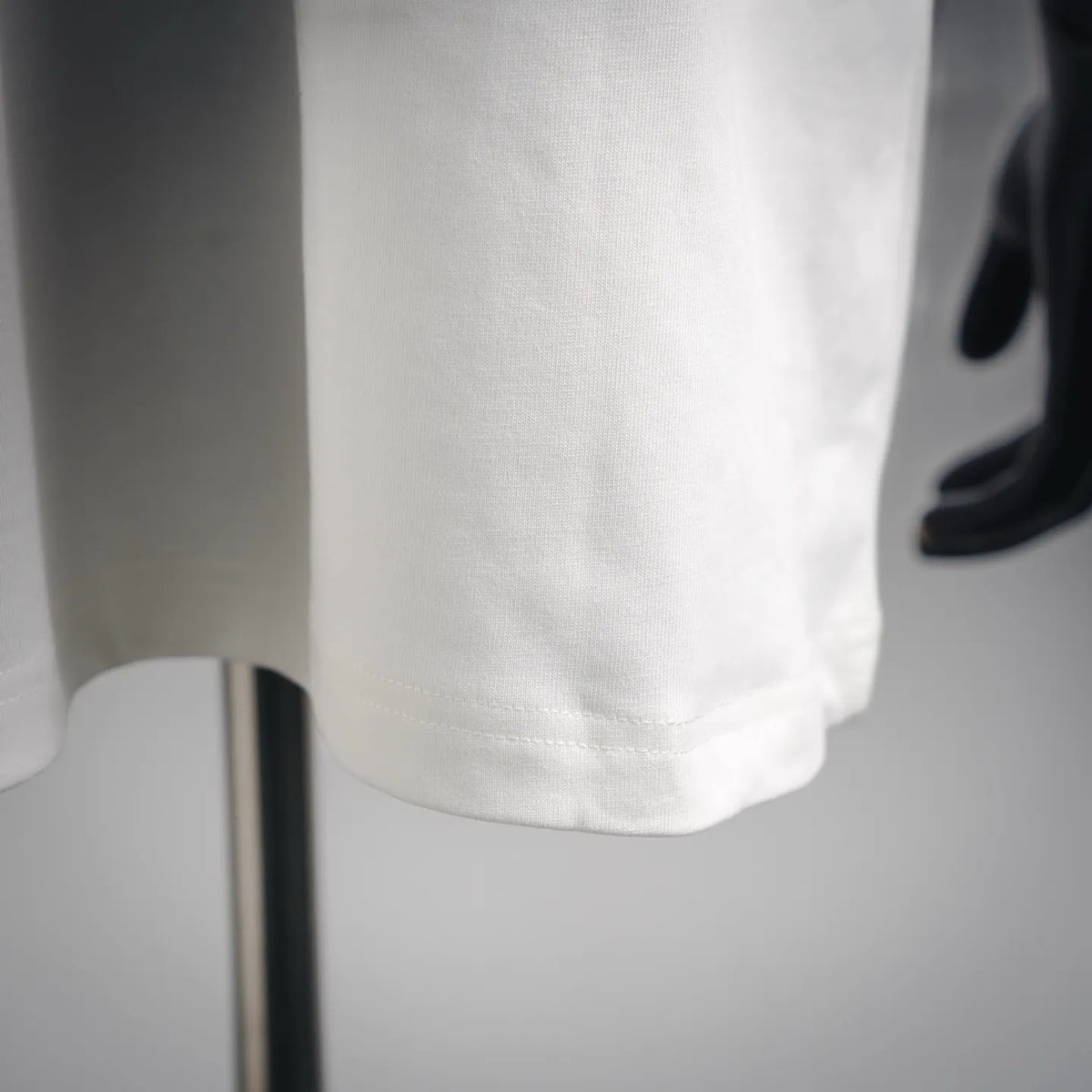 White T-shirt hem and side seam detail