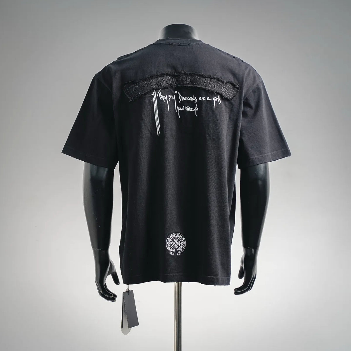 Black short-sleeve T-shirt with back white script and circular chest logo detail