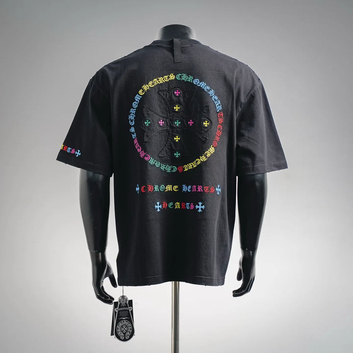 Black short-sleeve T-shirt with large back circular multicolor logo graphic and text.