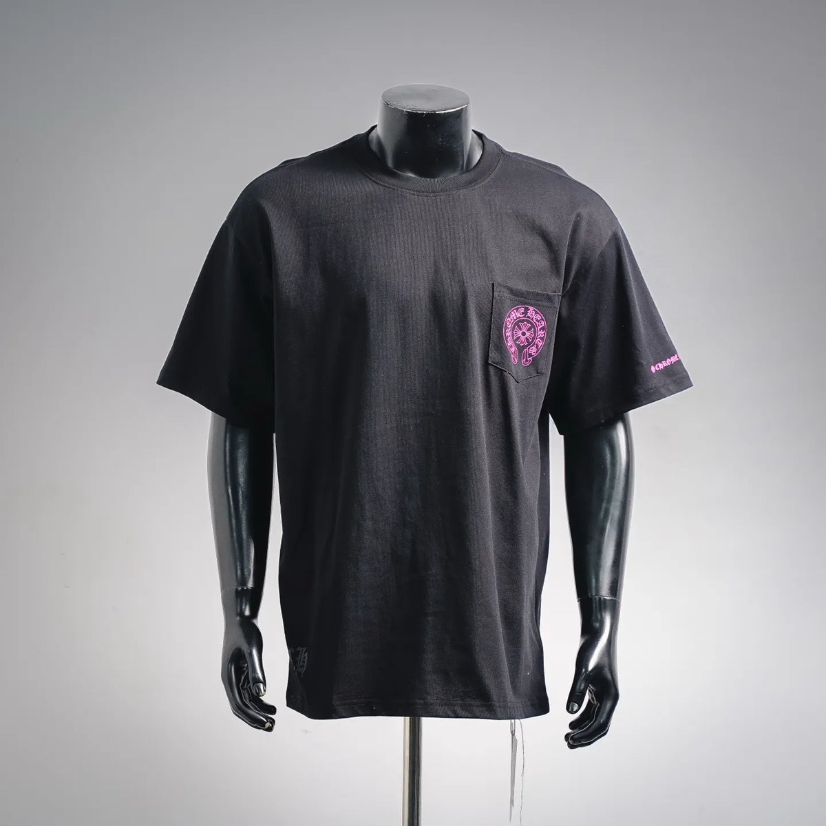 Black short-sleeve T-shirt with pink logo graphic on chest pocket