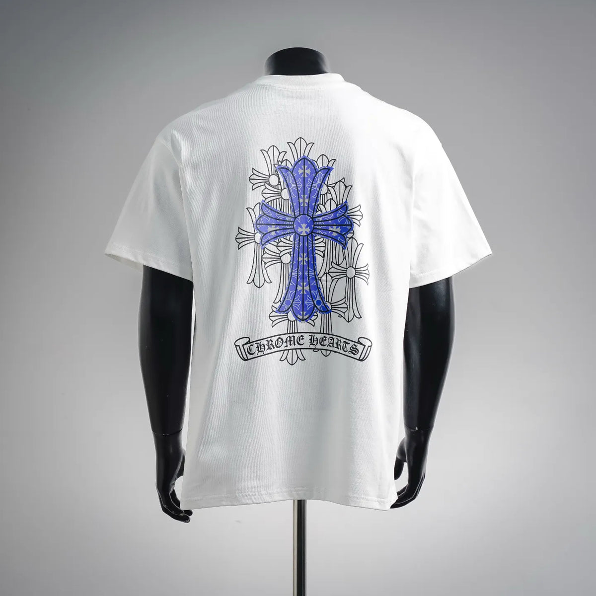 White graphic T-shirt with blue cross and banner text on the back