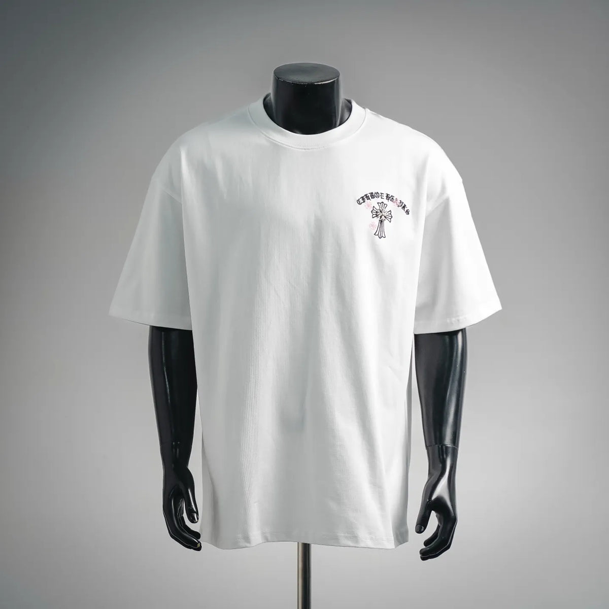 White short-sleeve T-shirt with small chest graphic print