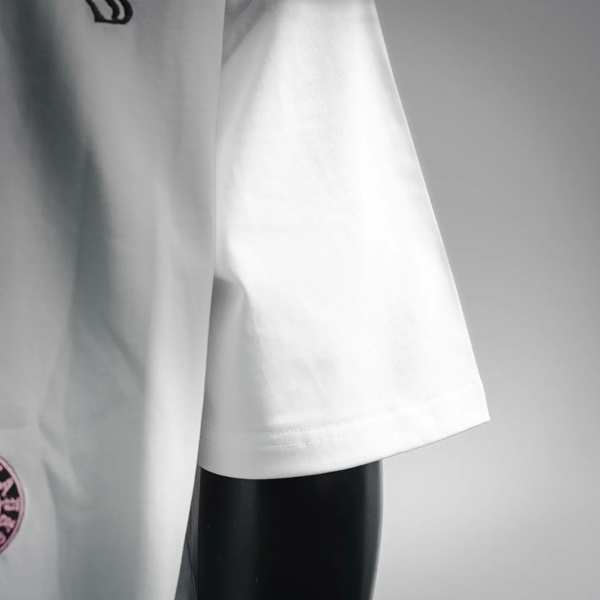 White short-sleeve T-shirt side view with clean hem