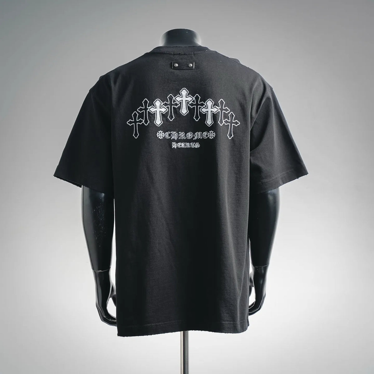 Black short-sleeve T-shirt with large back cross-and-text graphic in white