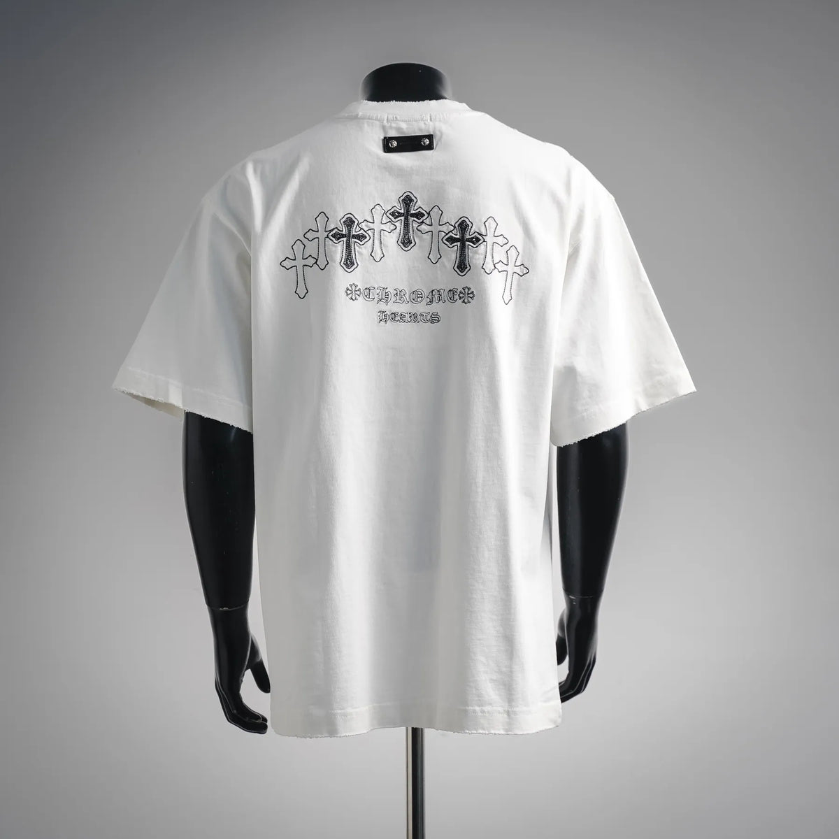 White short-sleeve T-shirt with large back cross and gothic text graphic