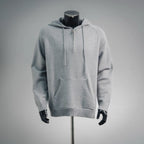 Light gray zip-up hoodie with drawstring hood and kangaroo pocket.