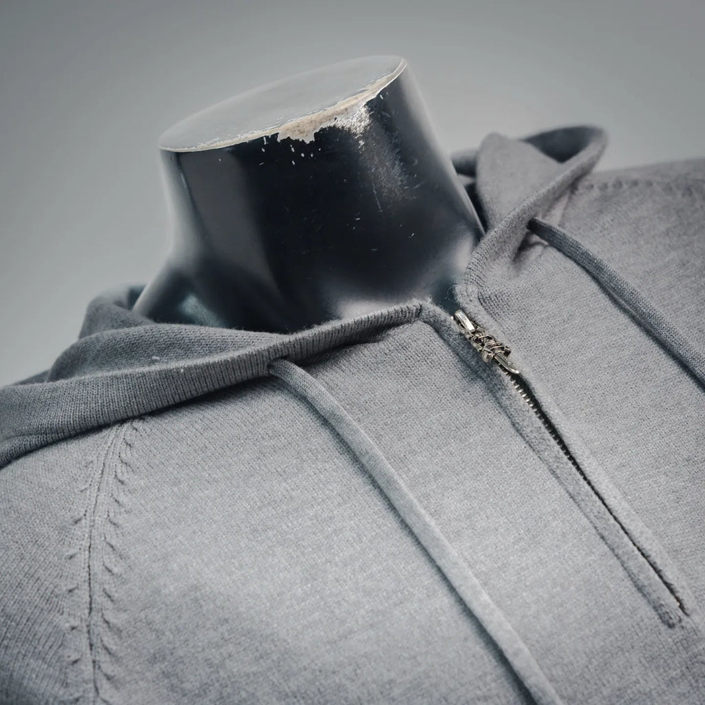 Light gray zip-up hoodie with front zipper and hood collar detail.