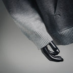 Light gray hoodie sleeves with ribbed cuffs.