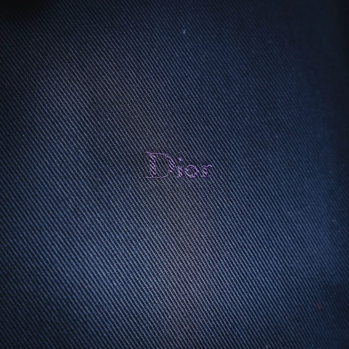 Navy denim fabric with Dior-embroidered logo detail