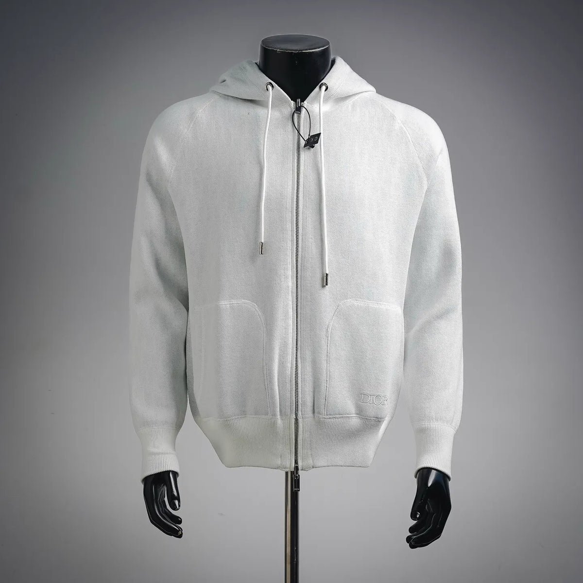 White zip-up hoodie coat with drawstring hood and two front pockets