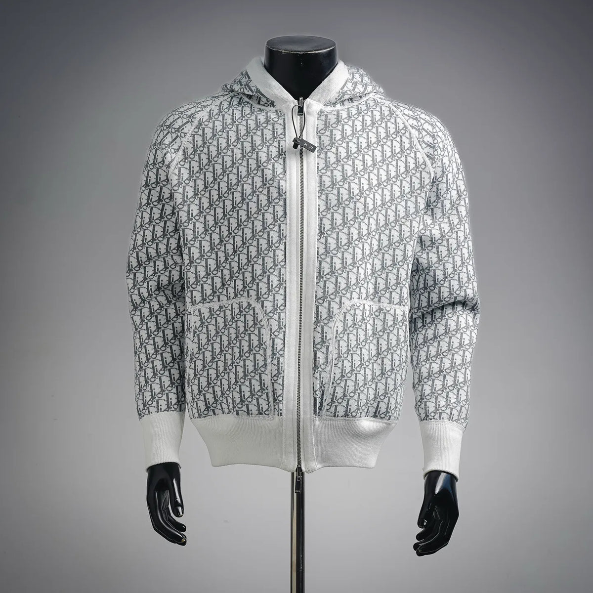 White zip-up hoodie coat with allover monogram pattern and two front pockets