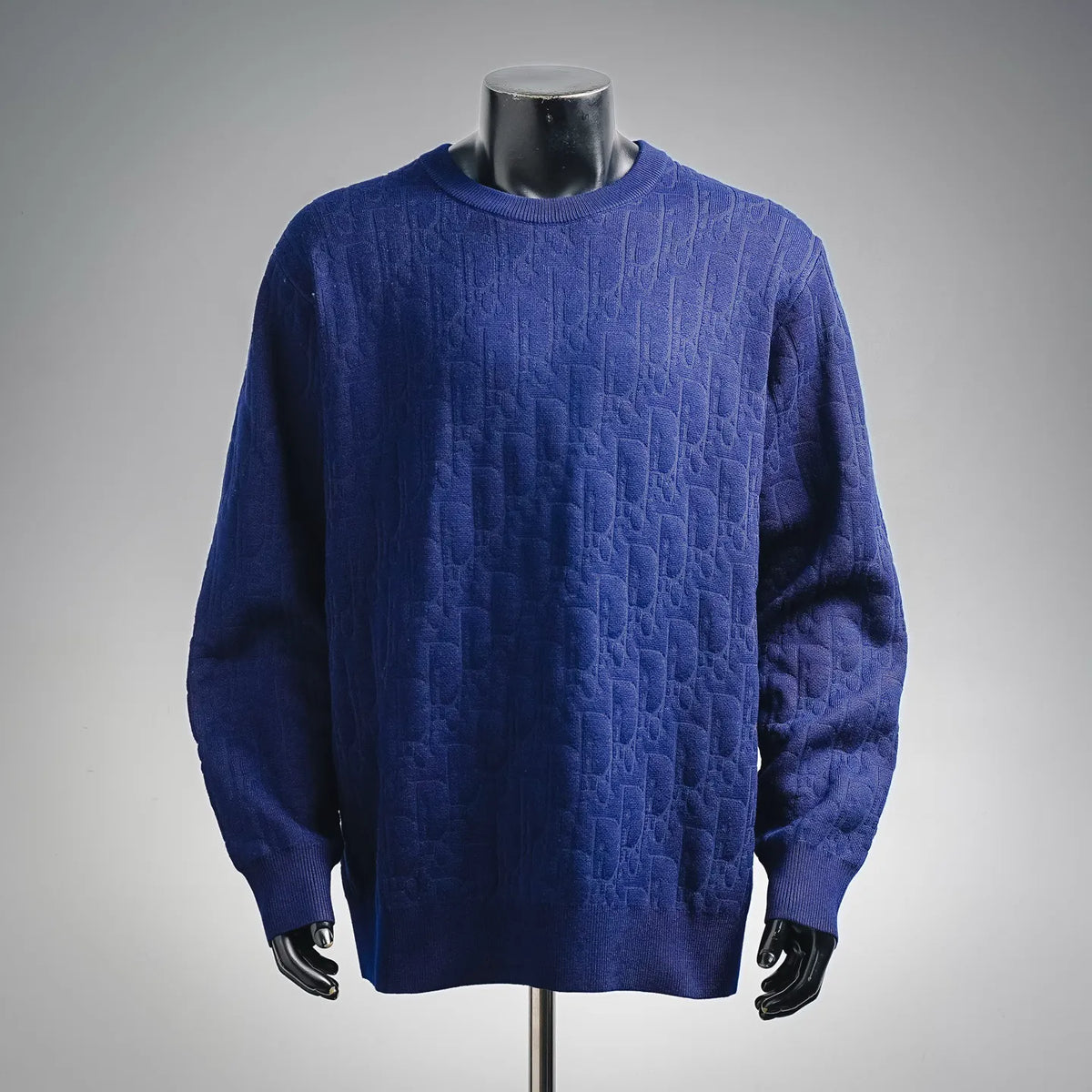 Blue textured knit crewneck sweater with long sleeves