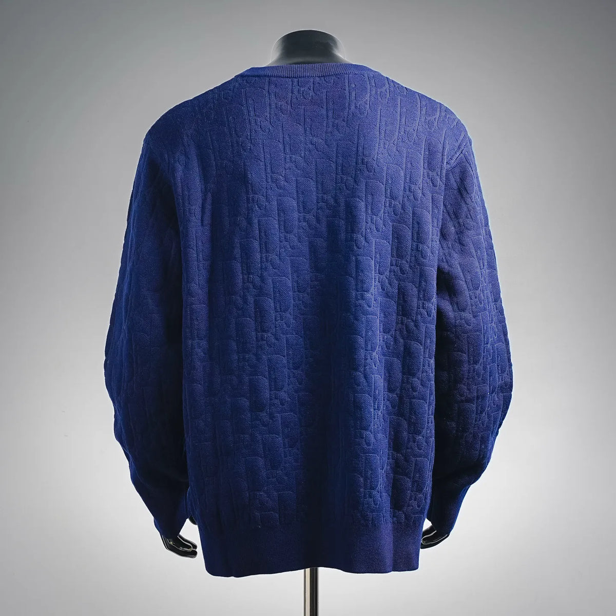 Blue textured knit crewneck sweater, back view
