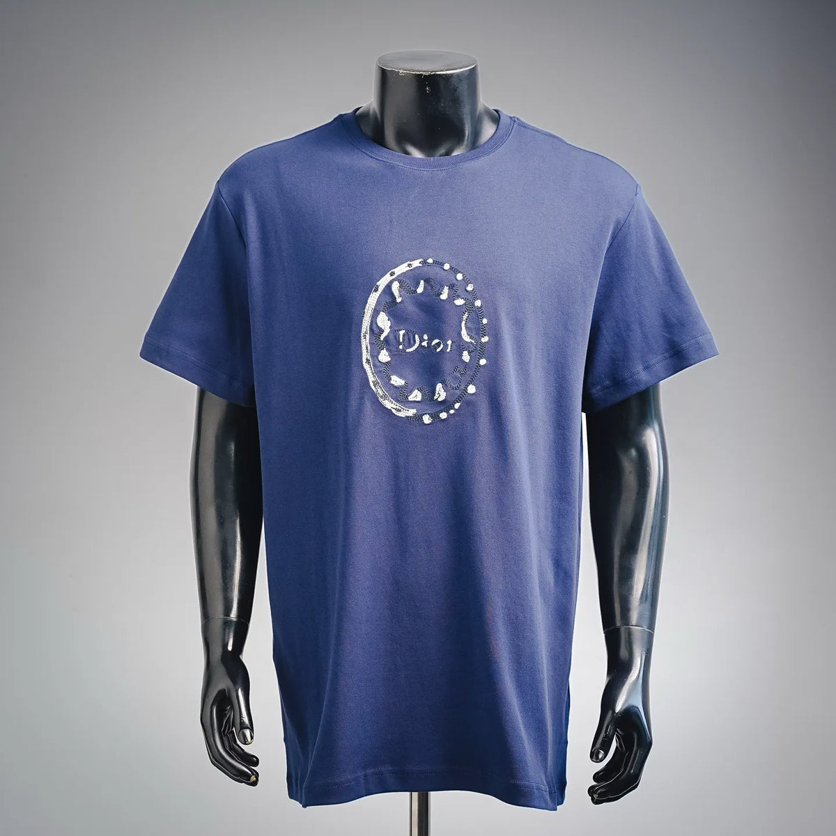 Blue Dior short-sleeve T-shirt with circular white graphic on the chest