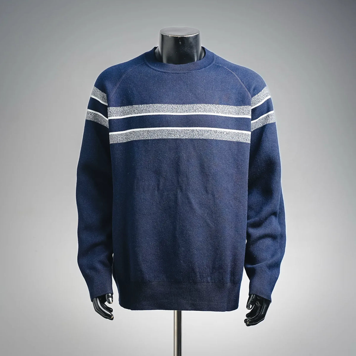 Christian Dior solid blue long-sleeve sweater with light gray stripe bands on sleeves