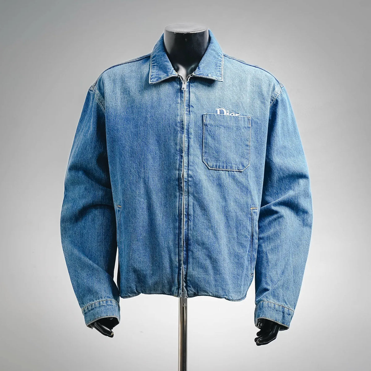 Light blue Dior denim zip-up jacket with stand collar and chest patch pocket