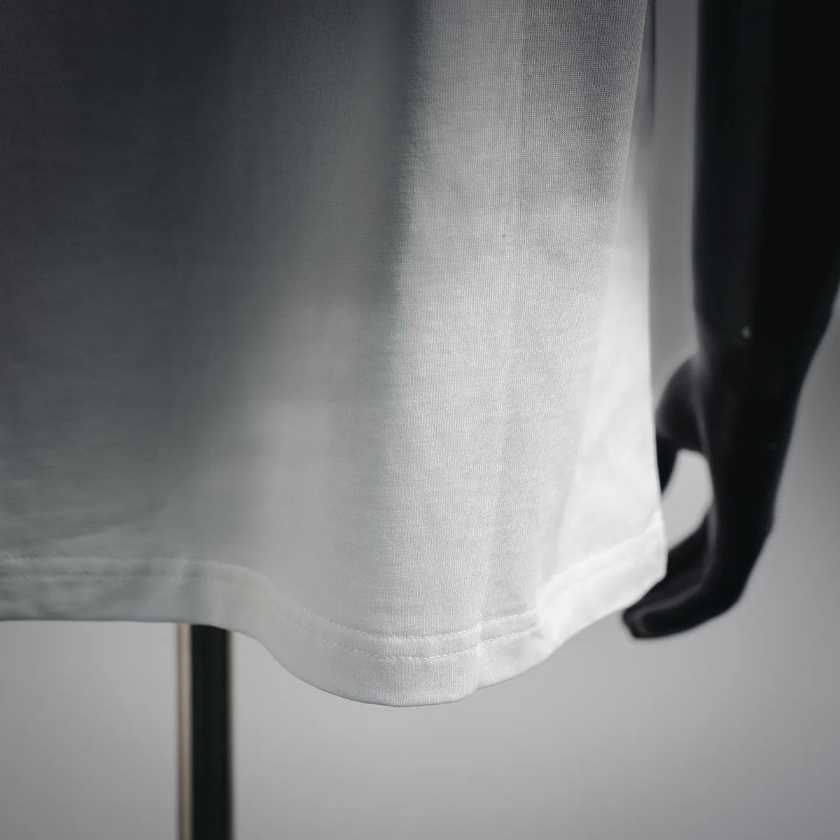 White T-shirt hem and side seam detail