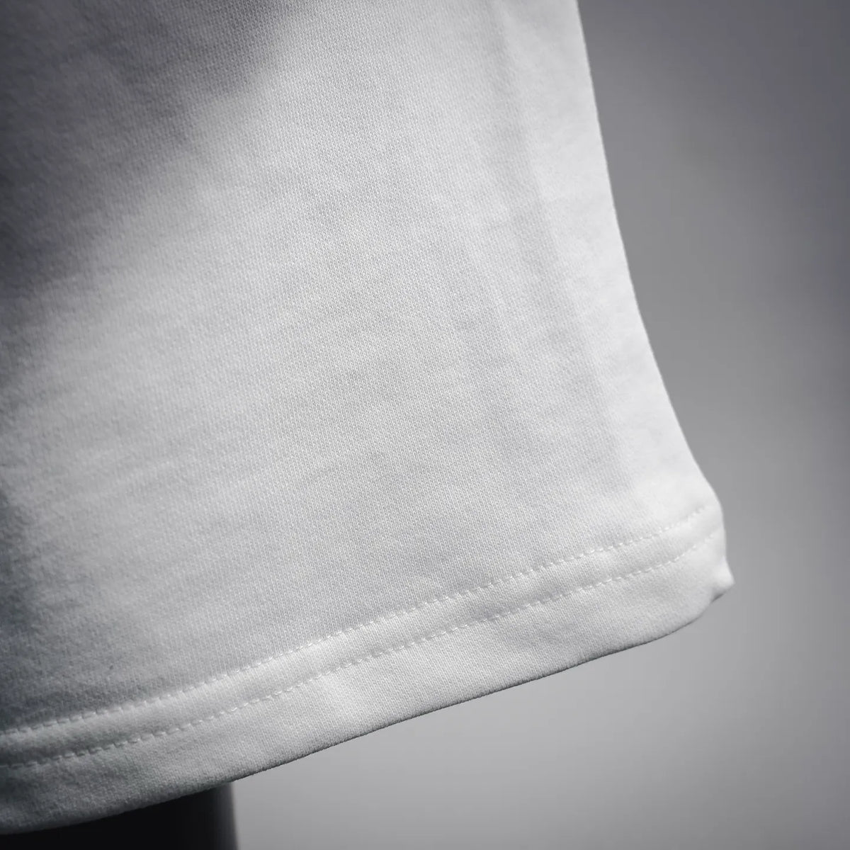 White cotton shorts hem with fine stitching detail