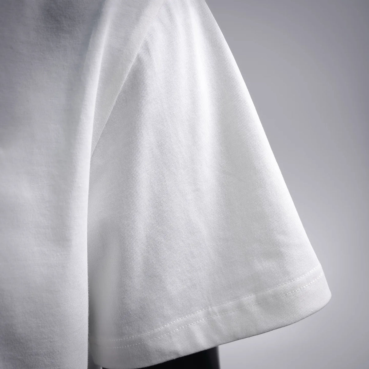 White T-shirt short sleeve with stitched hem and smooth knit finish.