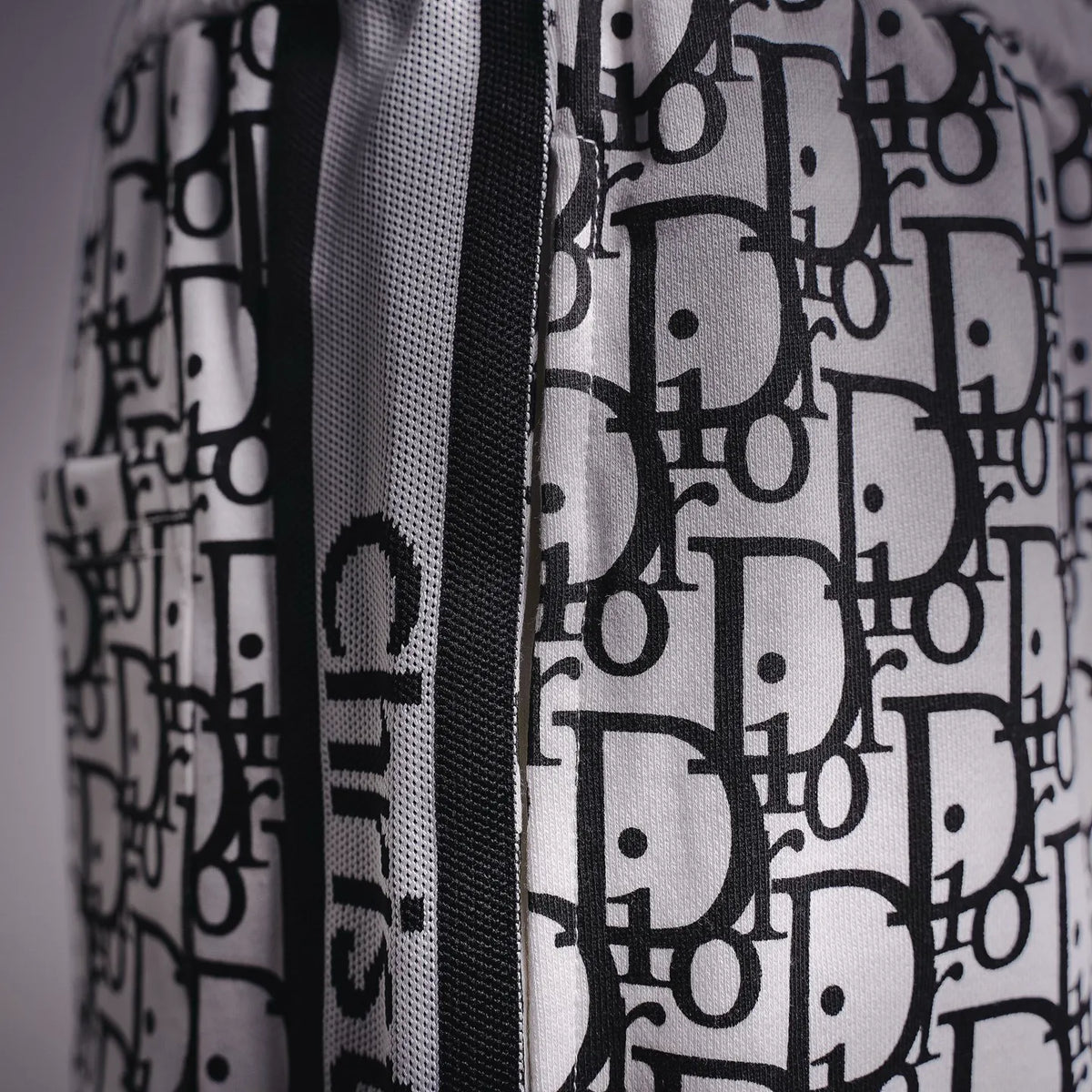 Dior logo-print shorts fabric with black pattern on white background