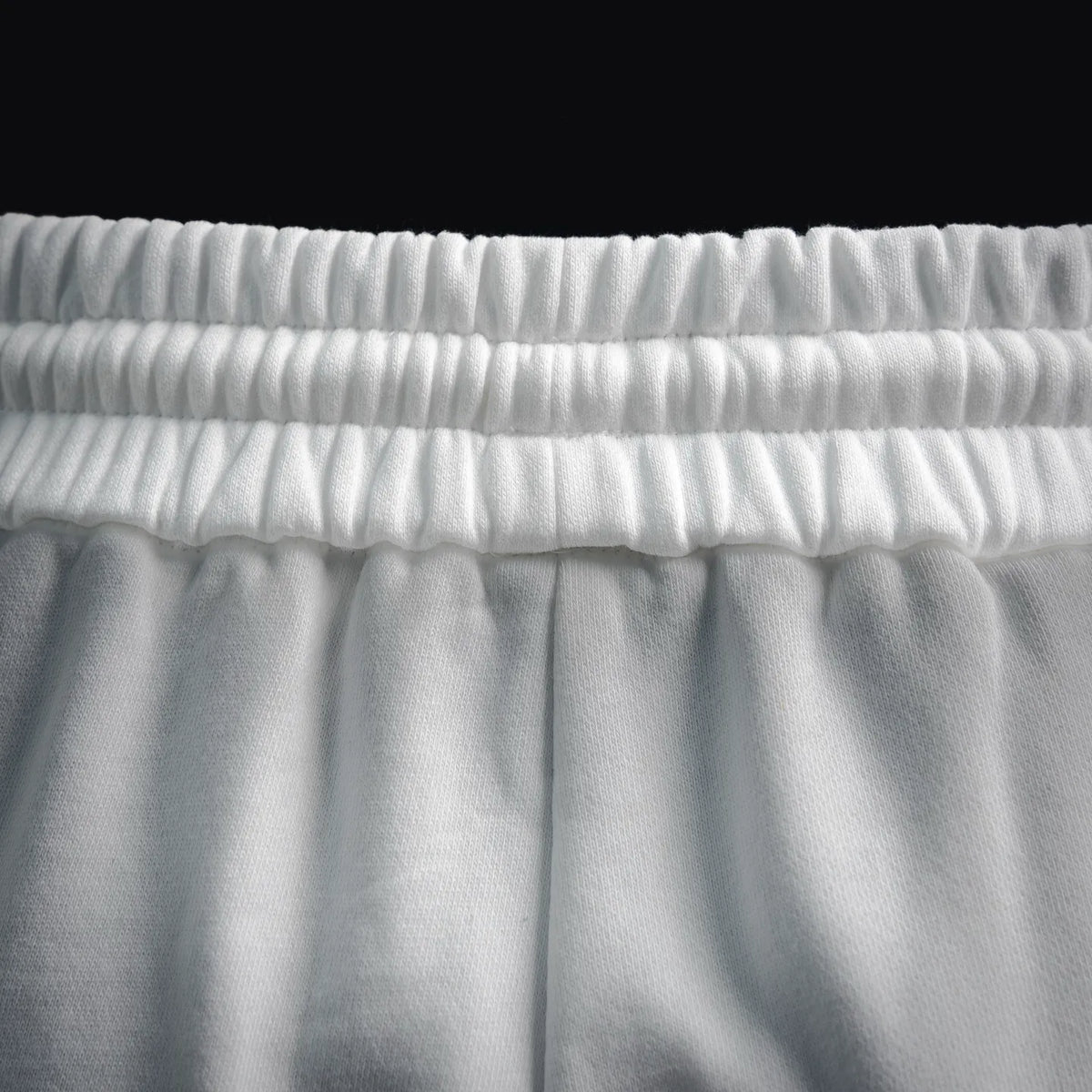 White shorts elastic waistband close-up
