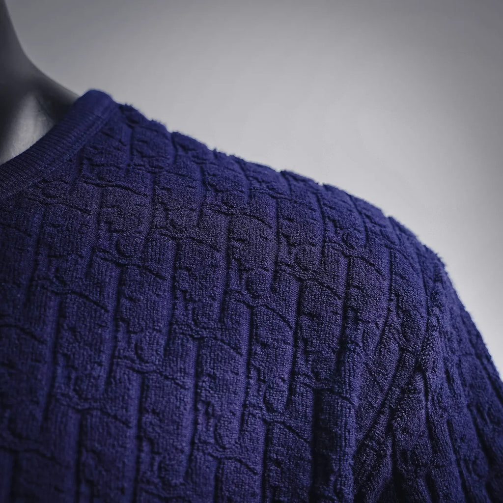 Dark blue short-sleeve knit shirt shoulder and sleeve with raised textured pattern