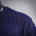 Dark blue short-sleeve knit shirt shoulder and sleeve with raised textured pattern