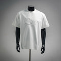White Dior crewneck T-shirt with embroidered “Dior” script logo on chest