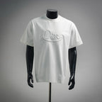 White Dior crewneck T-shirt with embroidered “Dior” script logo on chest