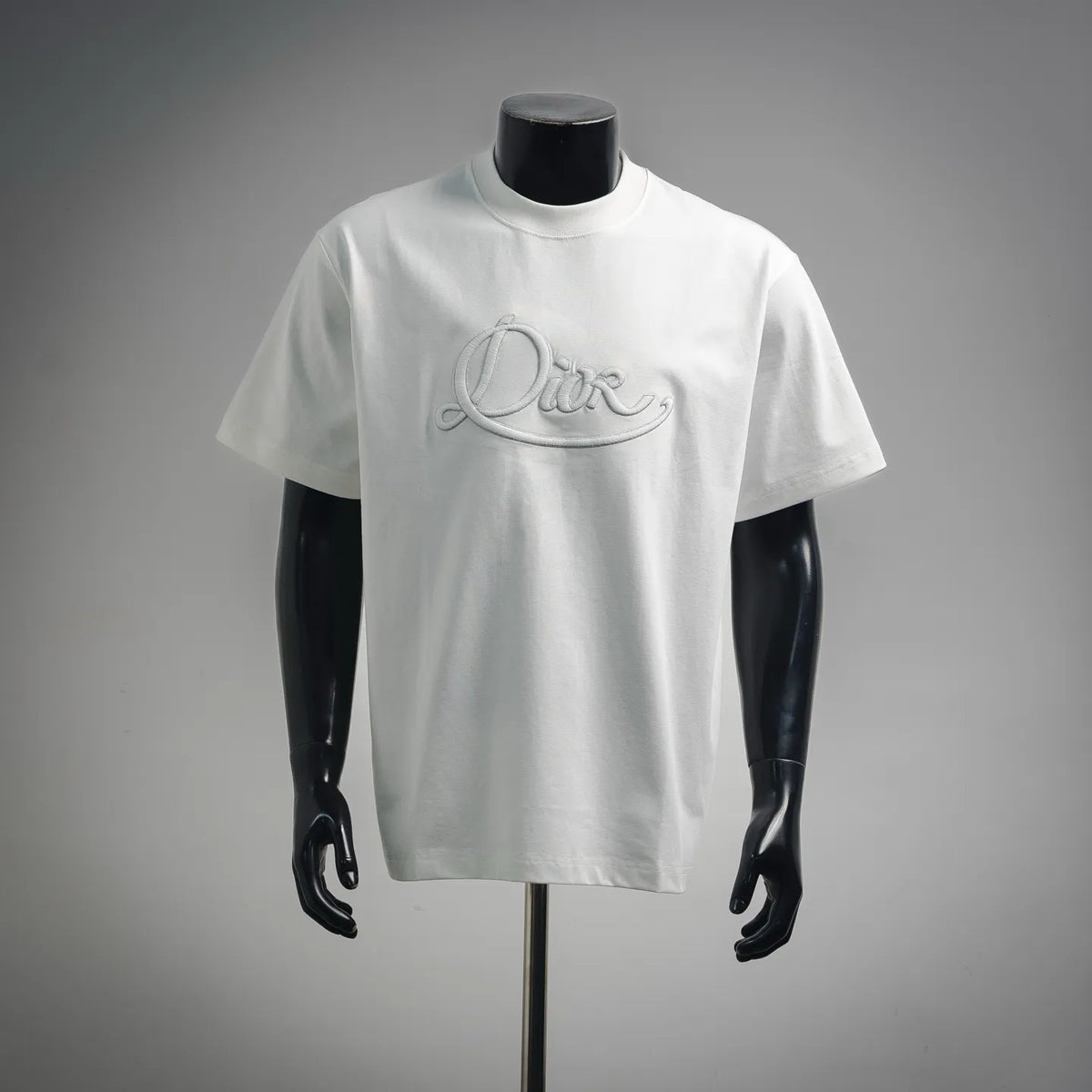 White Dior crewneck T-shirt with embroidered “Dior” script logo on chest