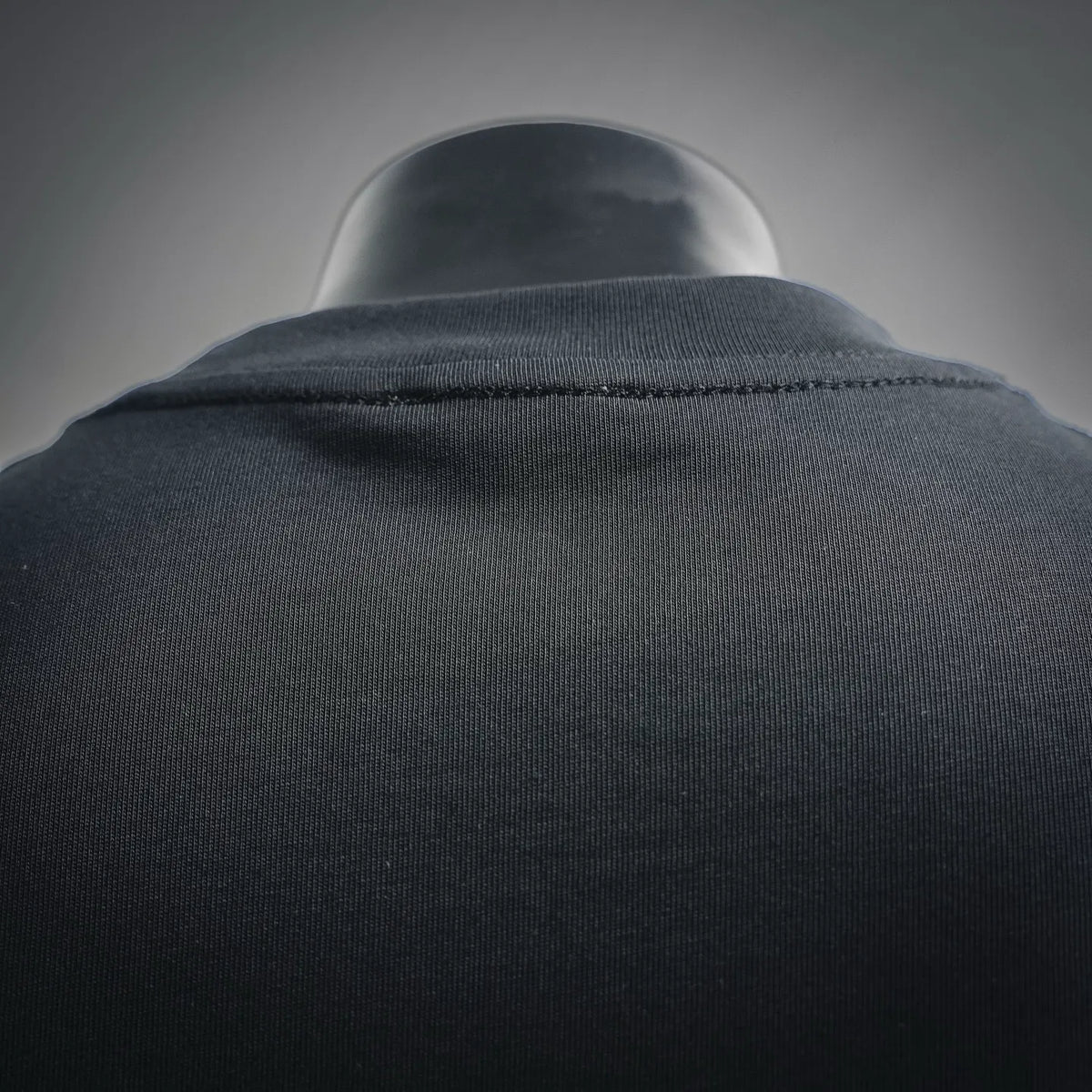 Black T-shirt back yoke seam with stitched neckline