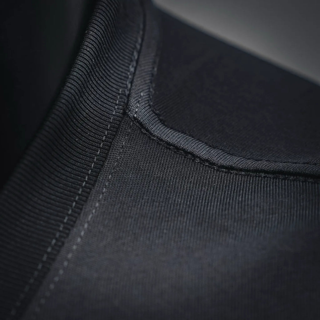 Black T-shirt ribbed neckline with close-up stitching