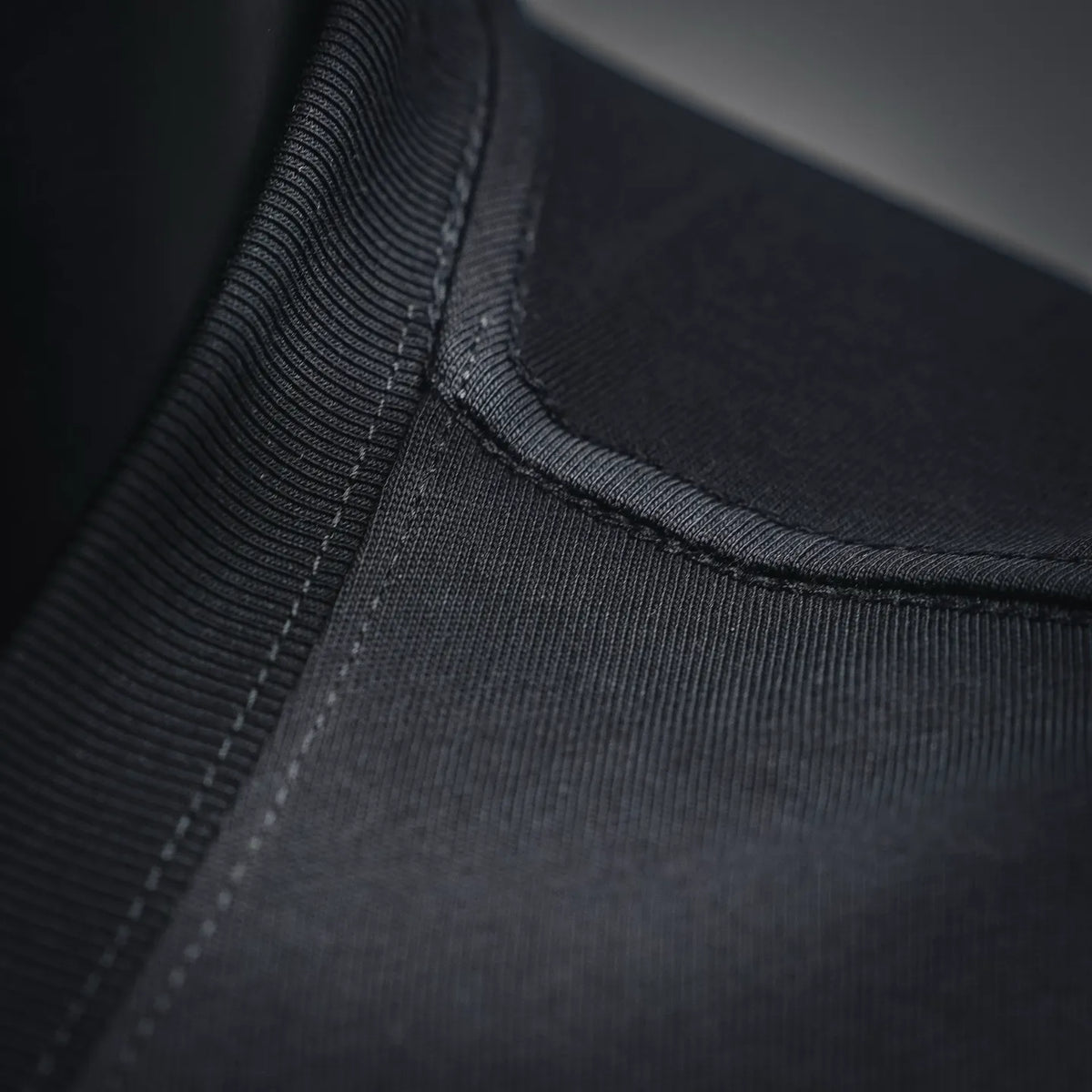 Black T-shirt ribbed neckline with close-up stitching