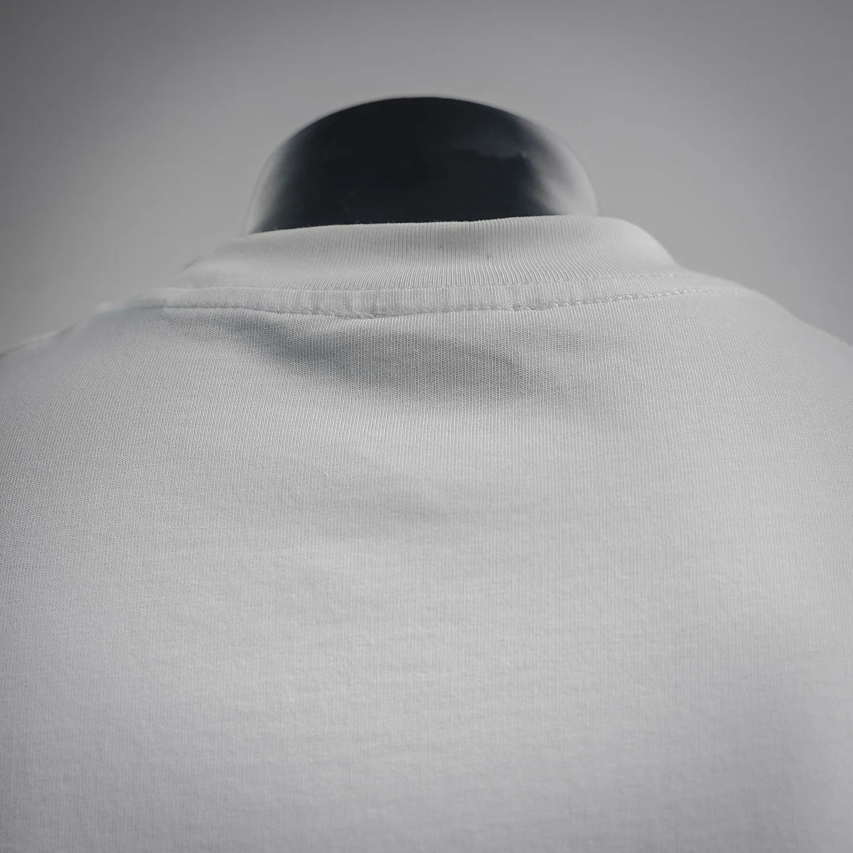 Dior white T-shirt neckline and collar seam close-up