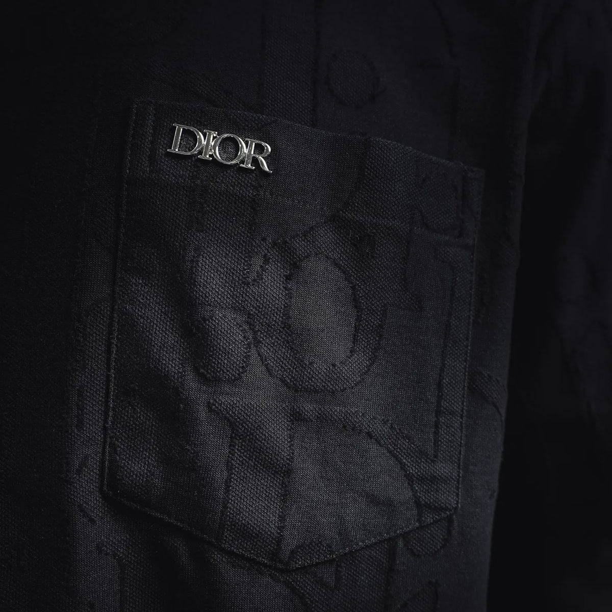 Black T-shirt chest pocket with embroidered Dior logo on pocket flap