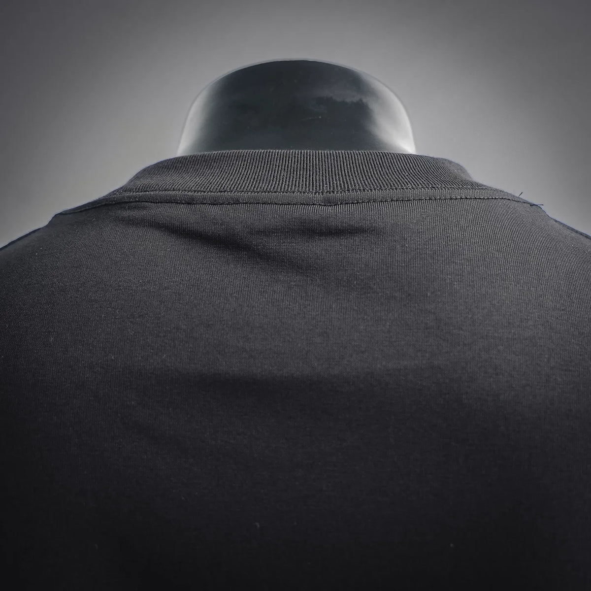 Black Dior T-shirt close-up of crew neck collar and neckline seam
