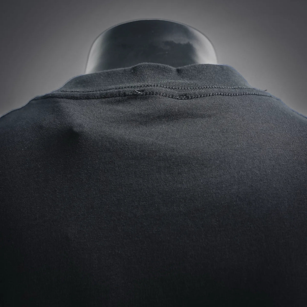 Dior T-shirt fabric close-up with ribbed collar and neckline