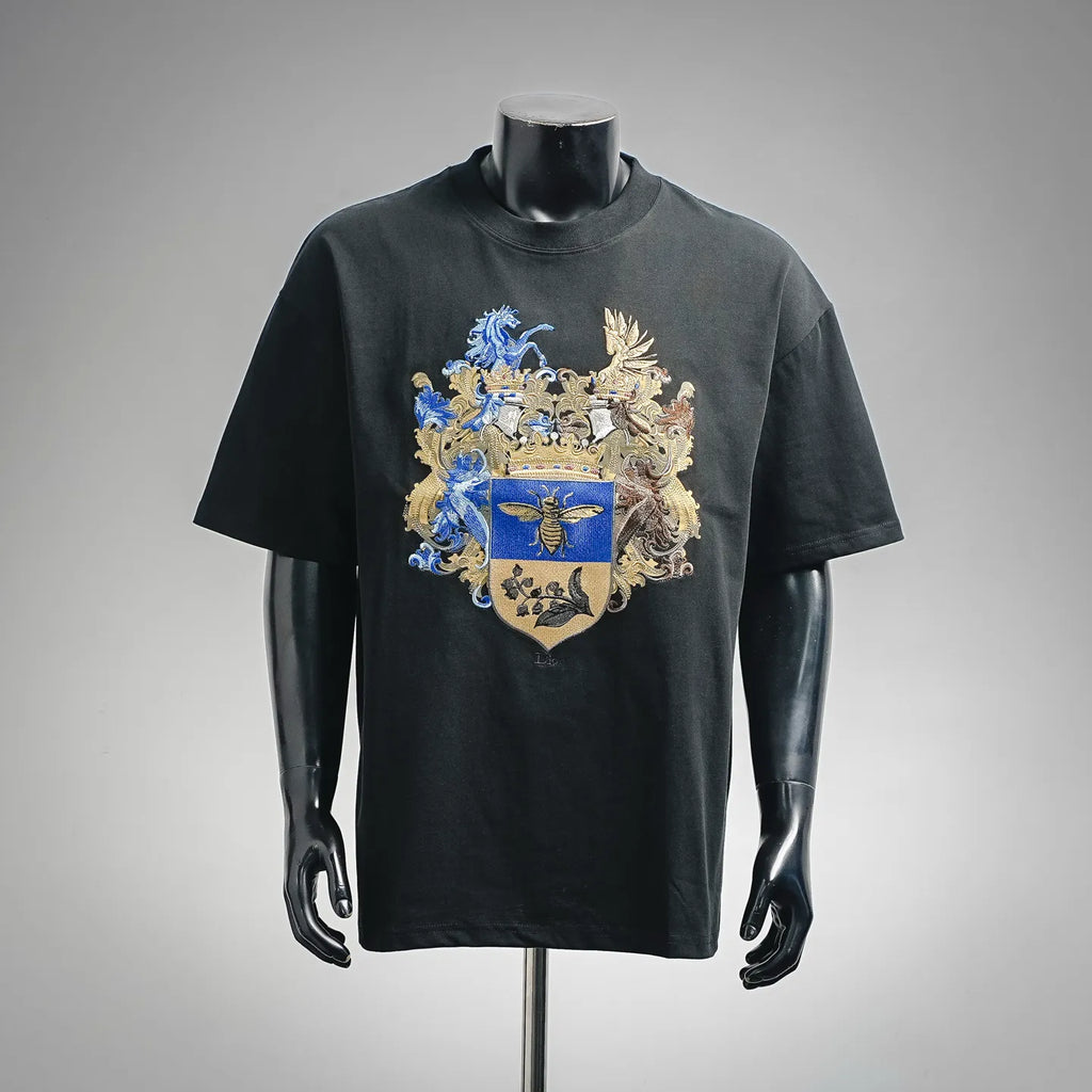Black short-sleeve T-shirt with large blue and gold crest graphic on the front