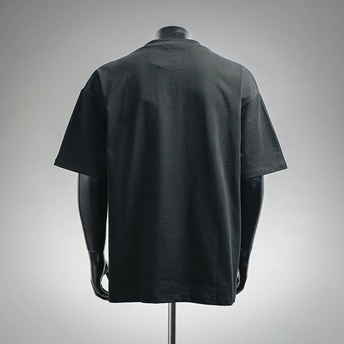 Black short-sleeve T-shirt shown from the back, plain design