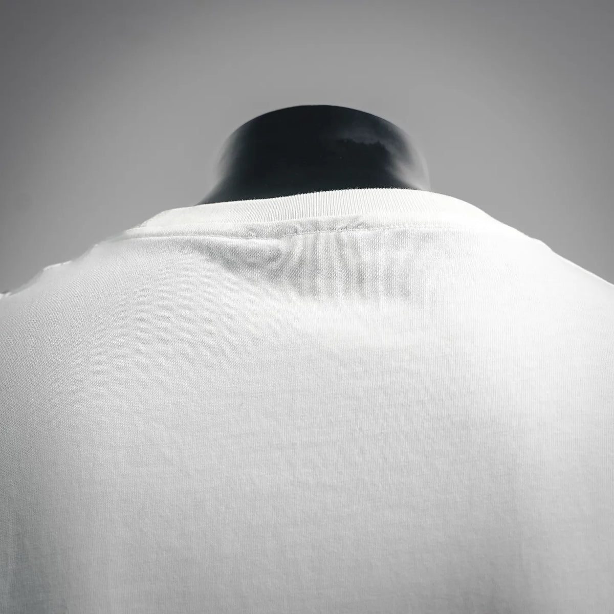 White T-shirt neckline and upper back close-up