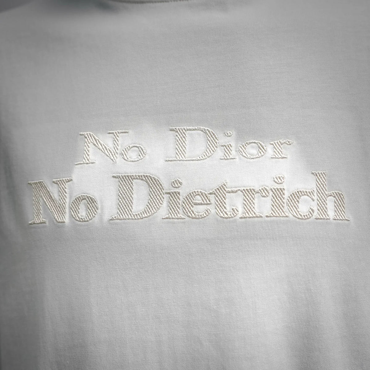 White T-shirt front logo text: No Dietrich Dior