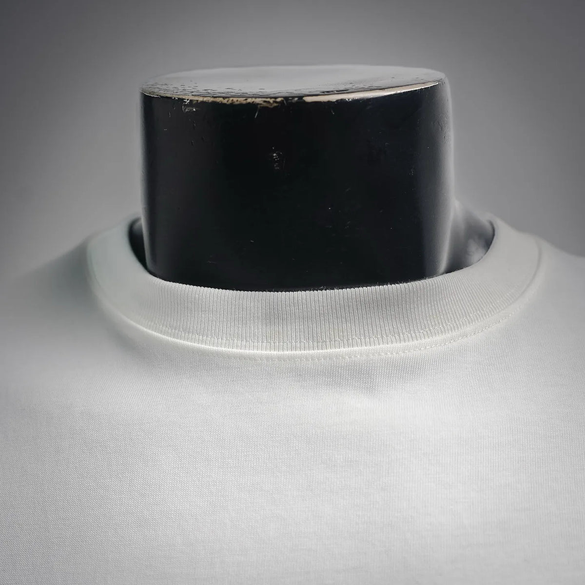 White T-shirt ribbed crew neck collar close-up