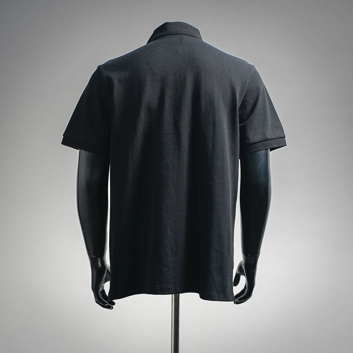 Dior polo shirt, short-sleeve back view, dark fabric, clean unbranded back