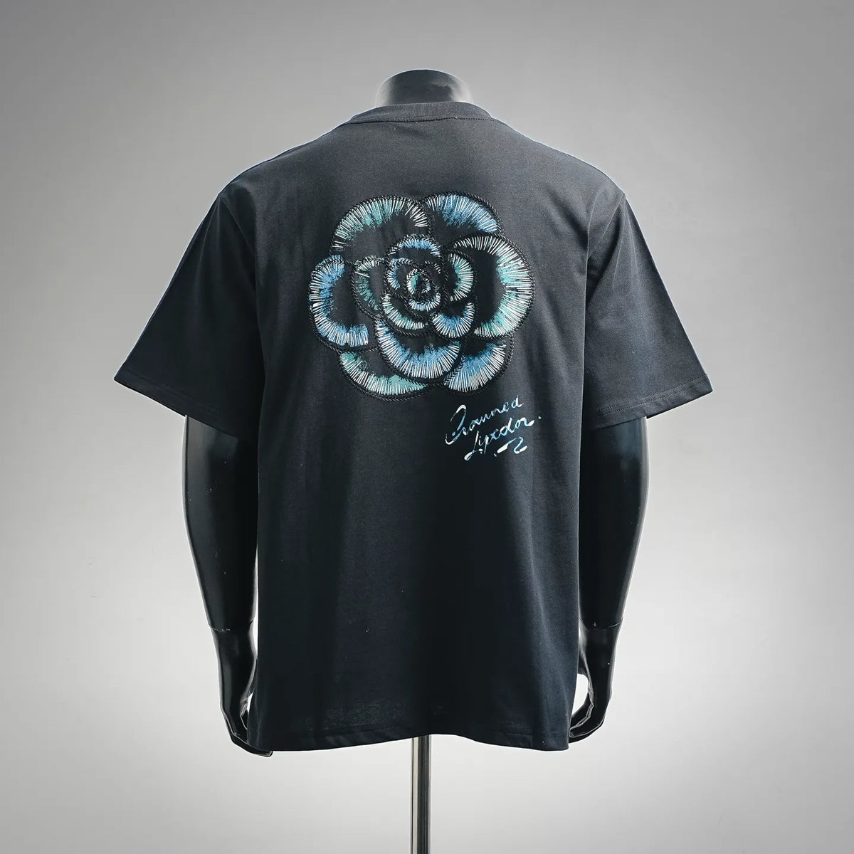 Dior black crewneck T-shirt with large blue back embroidery and script text