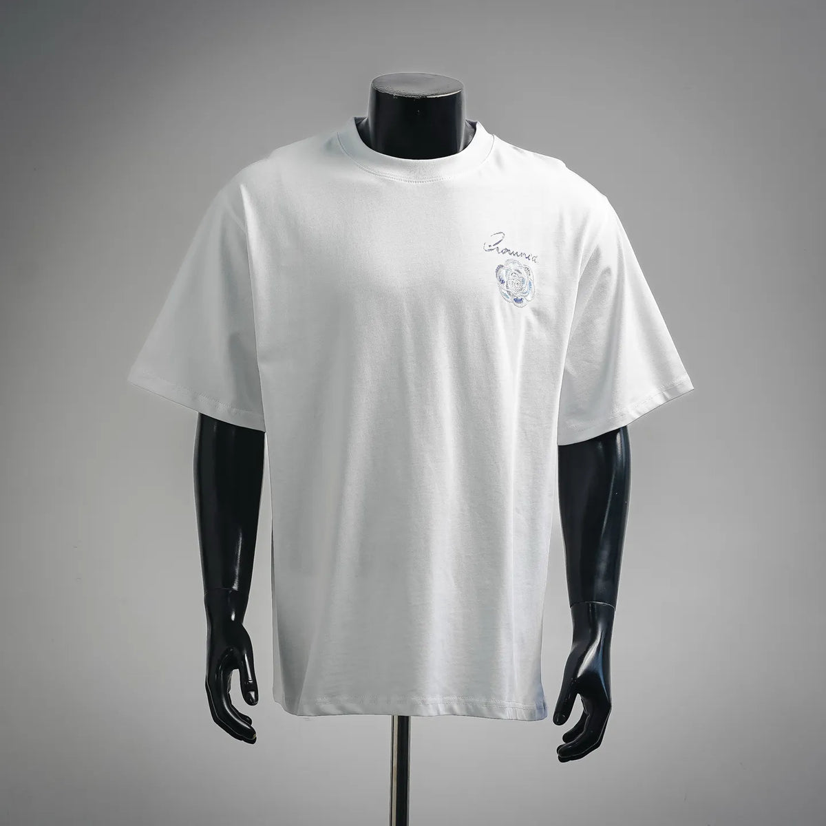 White Dior T-shirt with blue embroidered emblem at chest
