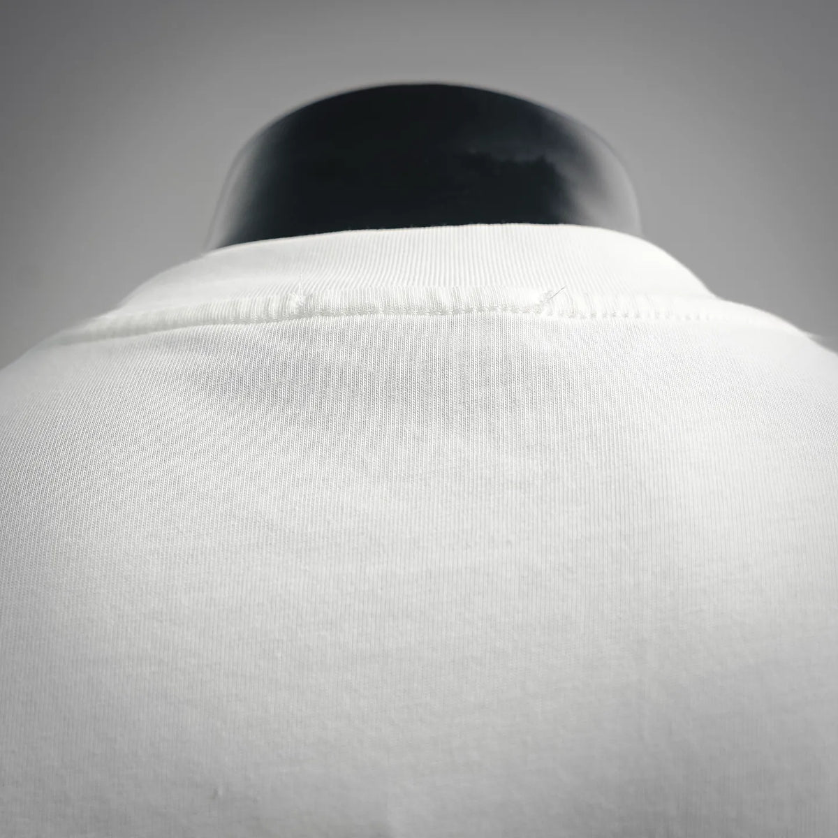 Dior white short-sleeve T-shirt close-up of back neckline and shoulder