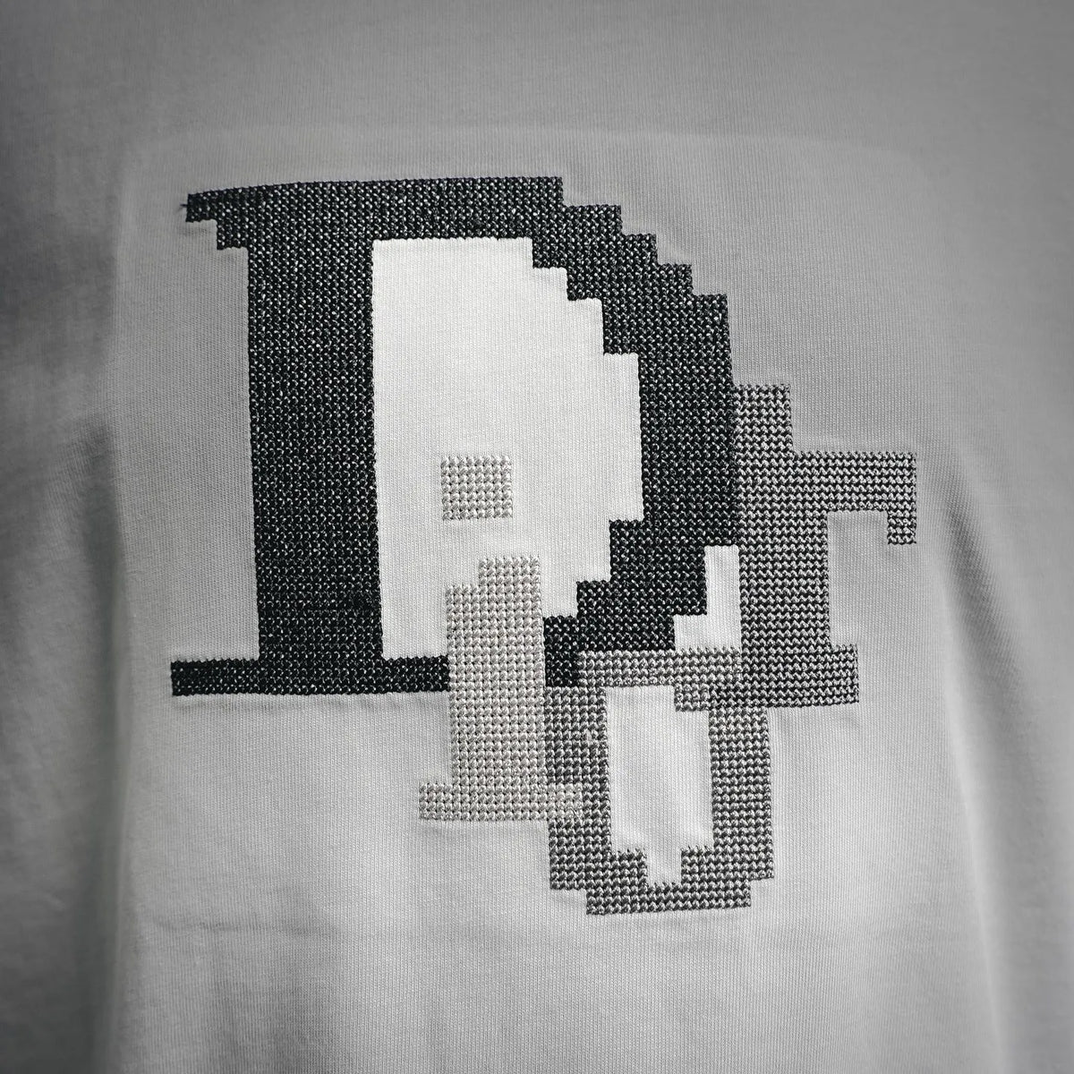 Dior white T-shirt with pixel-style black-and-white graphic logo
