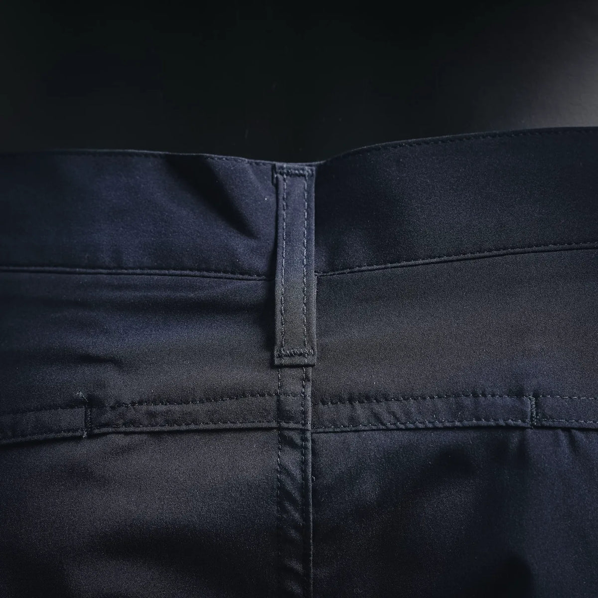 Navy pants front with belt loop and center fly stitching