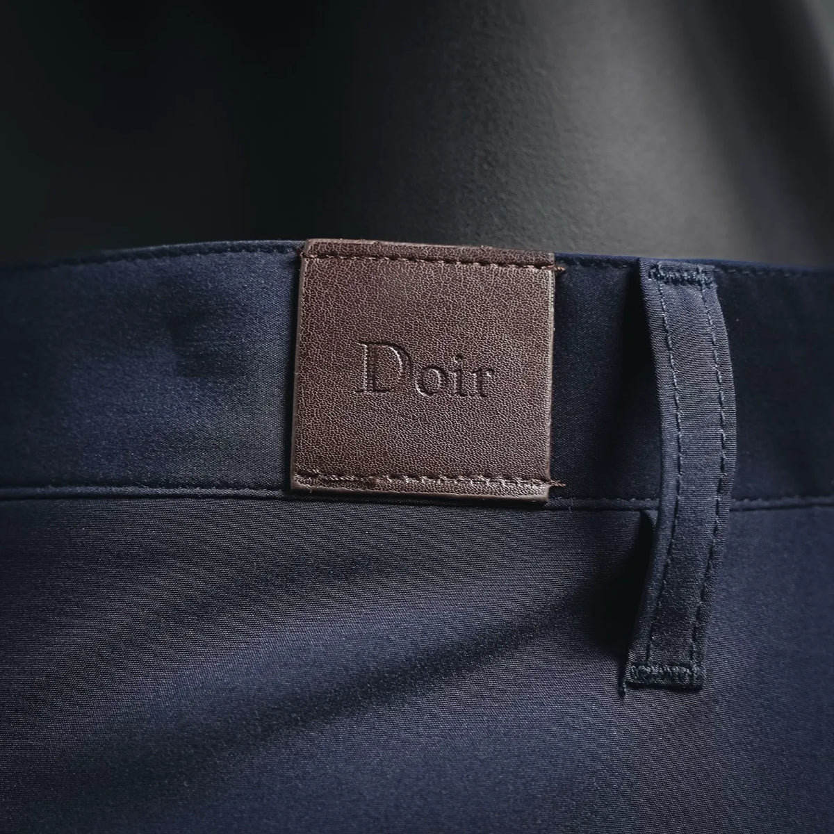 Navy waistband with Dior logo patch and adjustable tab