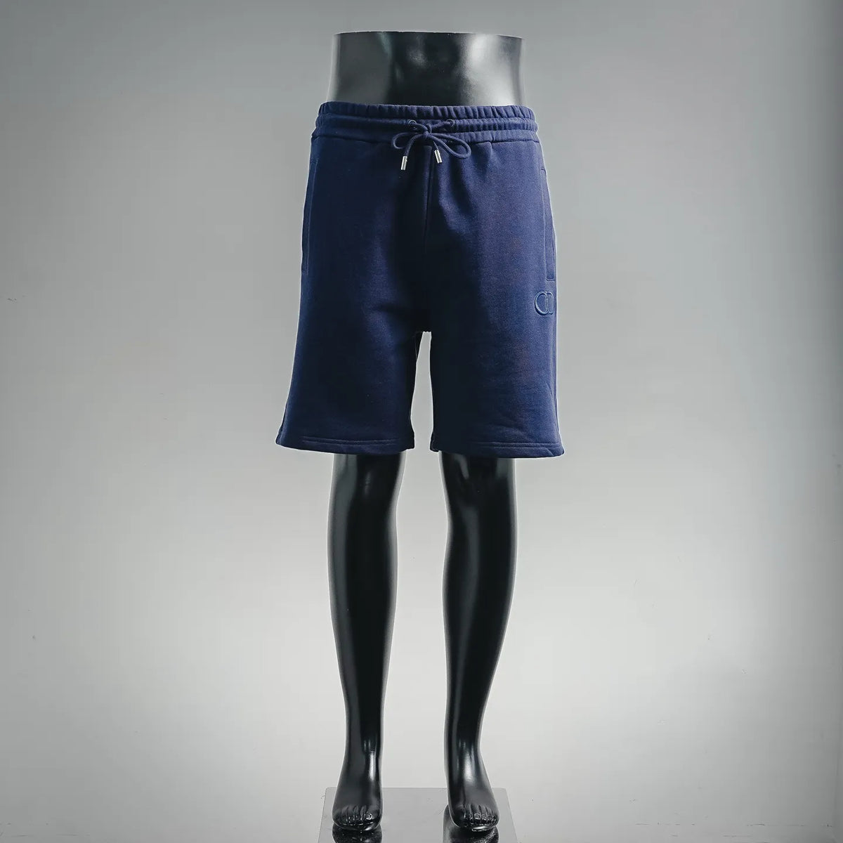 Navy Dior drawstring shorts with elastic waistband and knee-length cut